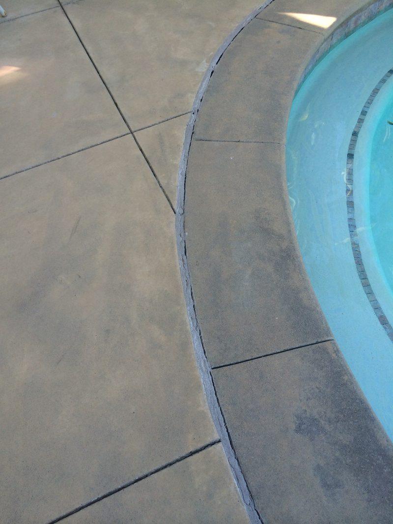 Hardened mastic cracked and pulled away from the coping